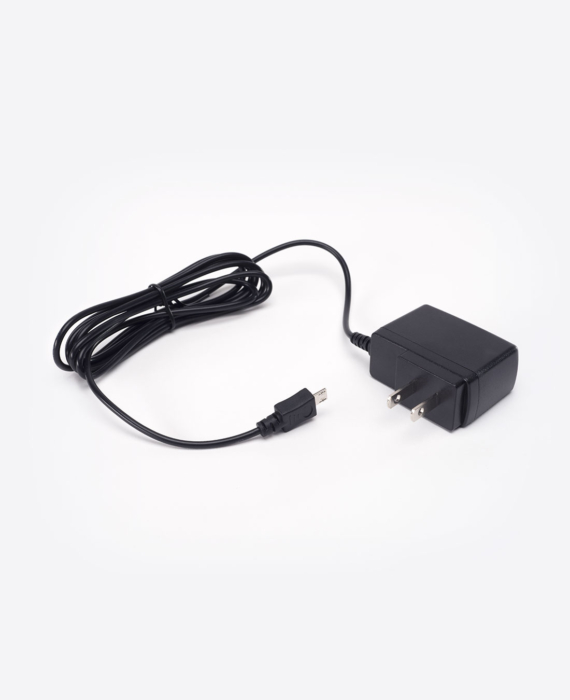 A black ac adapter on a white background.