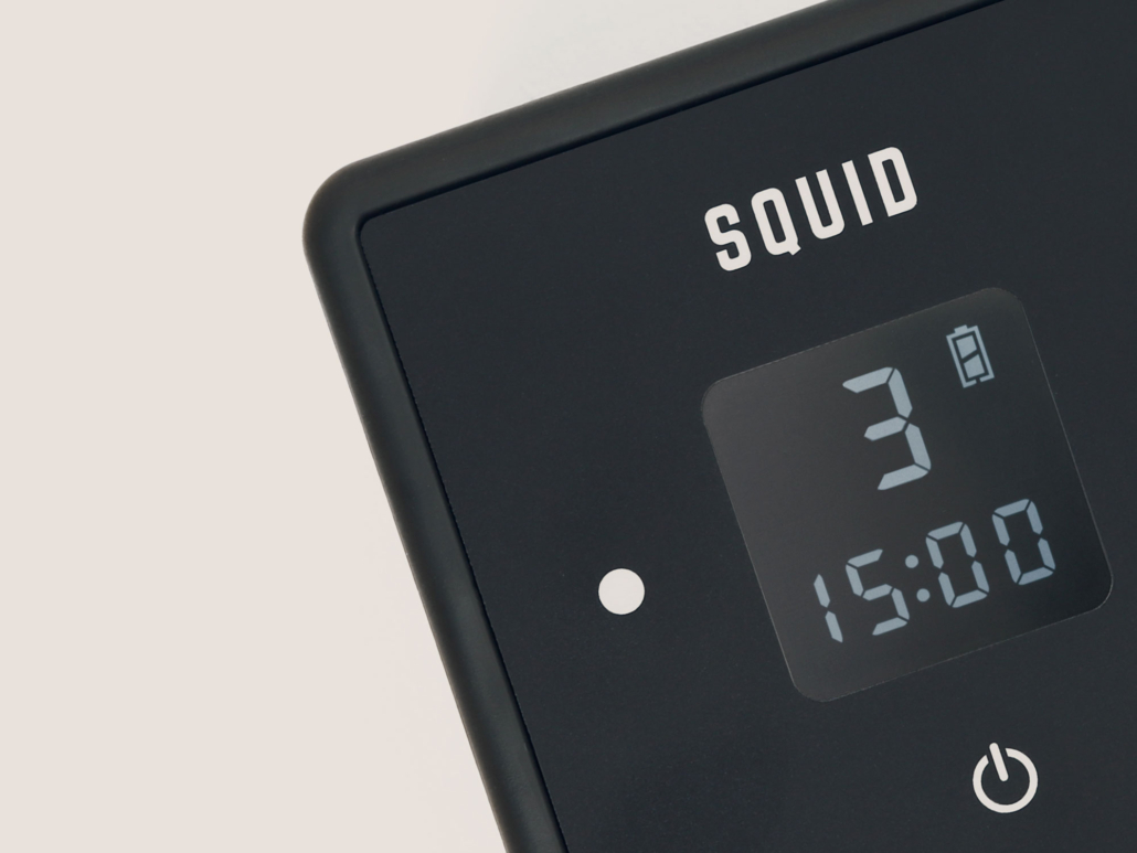 The squid clock is displayed on a white surface.