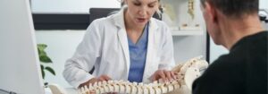 A chiropractor working with a patient
