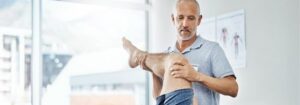 A physical therapist treating a patient