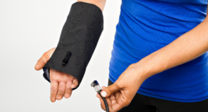 A person wearing the Squid Go wrist cold compression wrap